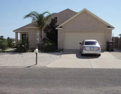 a car parked in front of white house