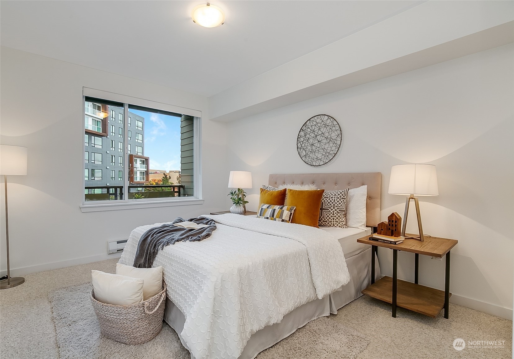 5440 Leary Avenue Northwest, Unit 417 Seattle, WA 98107 - Photo 12 of 21 a bedroom with a bed and window