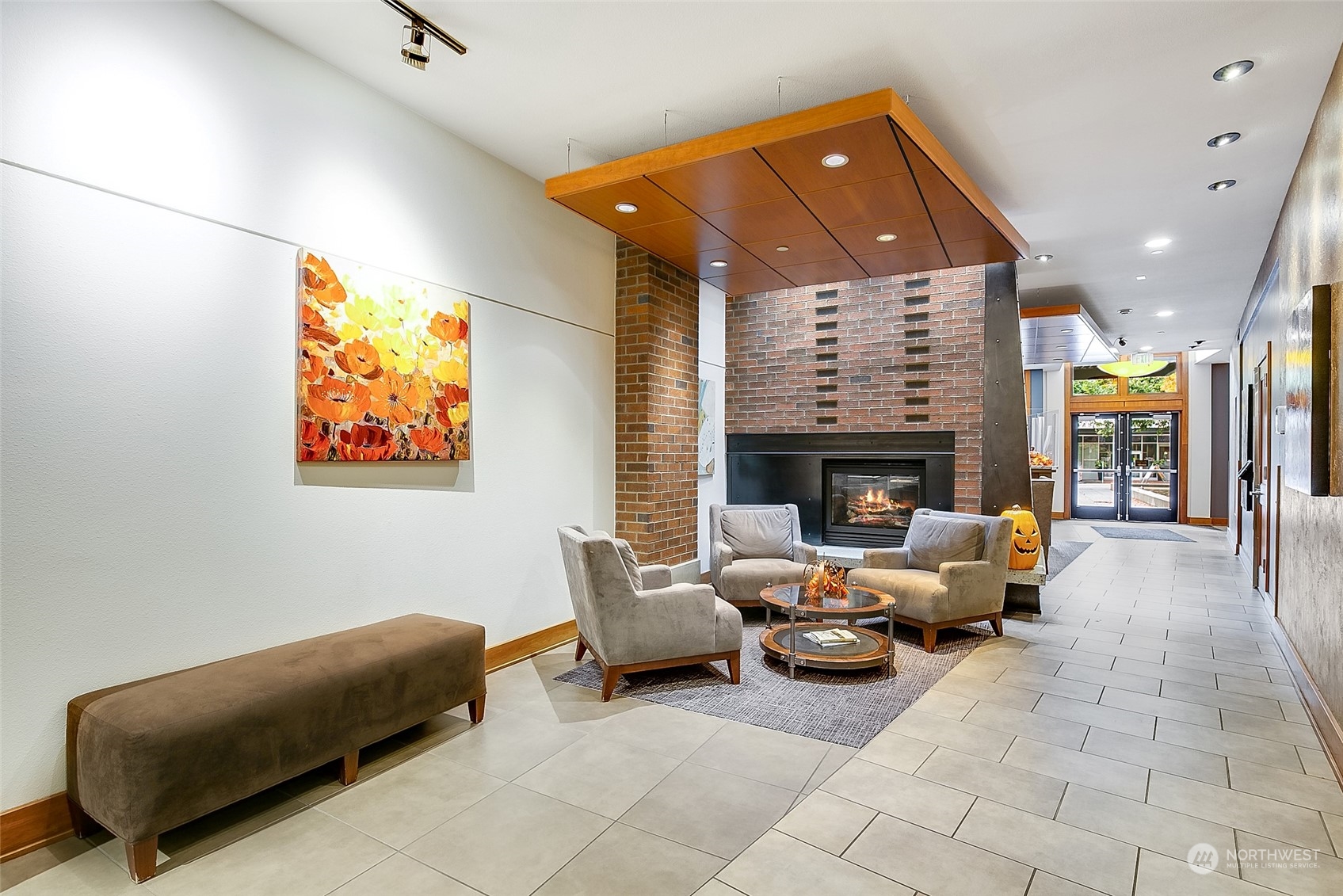 5440 Leary Avenue Northwest, Unit 417 Seattle, WA 98107 - Photo 19 of 21 a living room with furniture and a fireplace