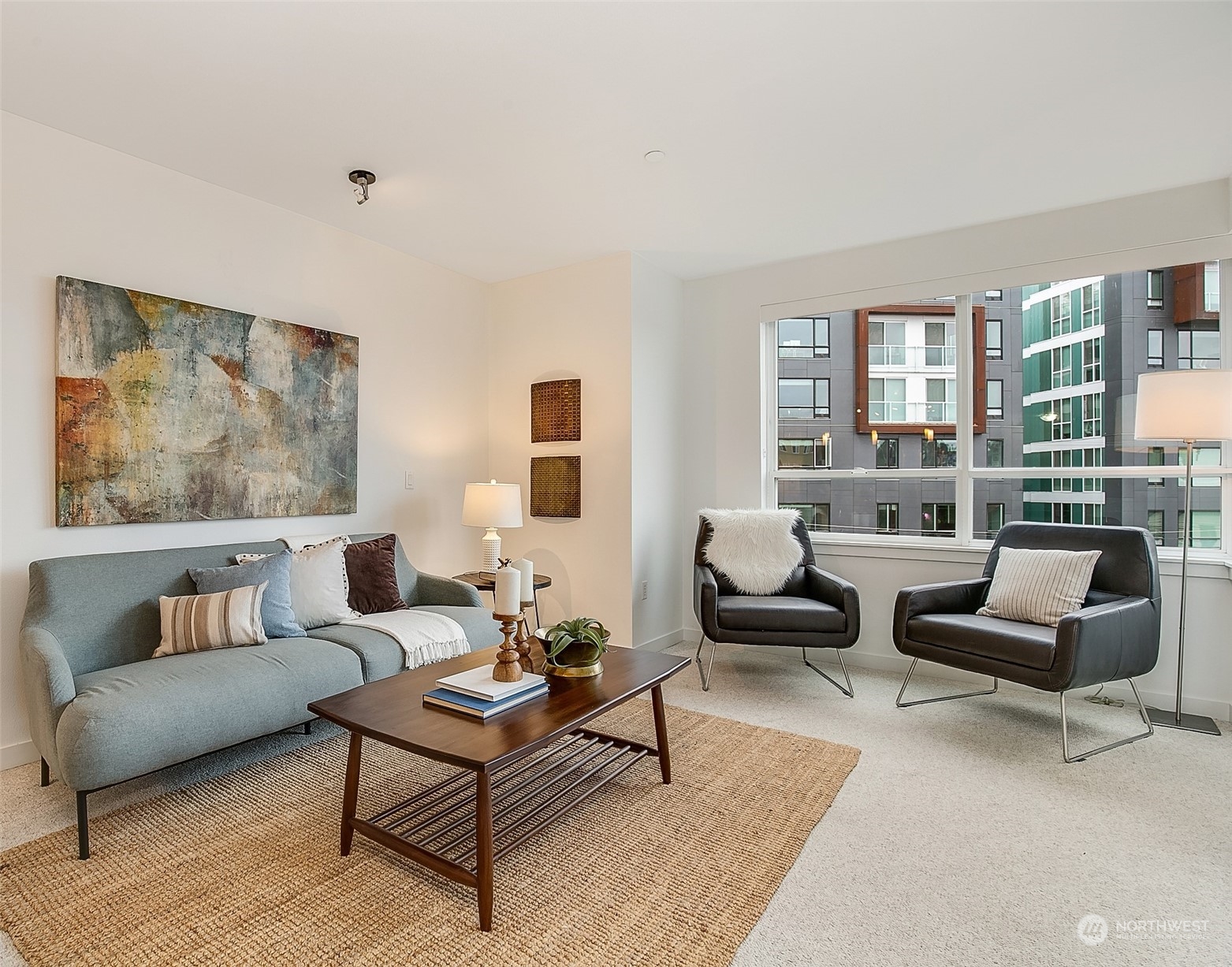 5440 Leary Avenue Northwest, Unit 417 Seattle, WA 98107 - Photo 2 of 21 a living room with furniture and a large window
