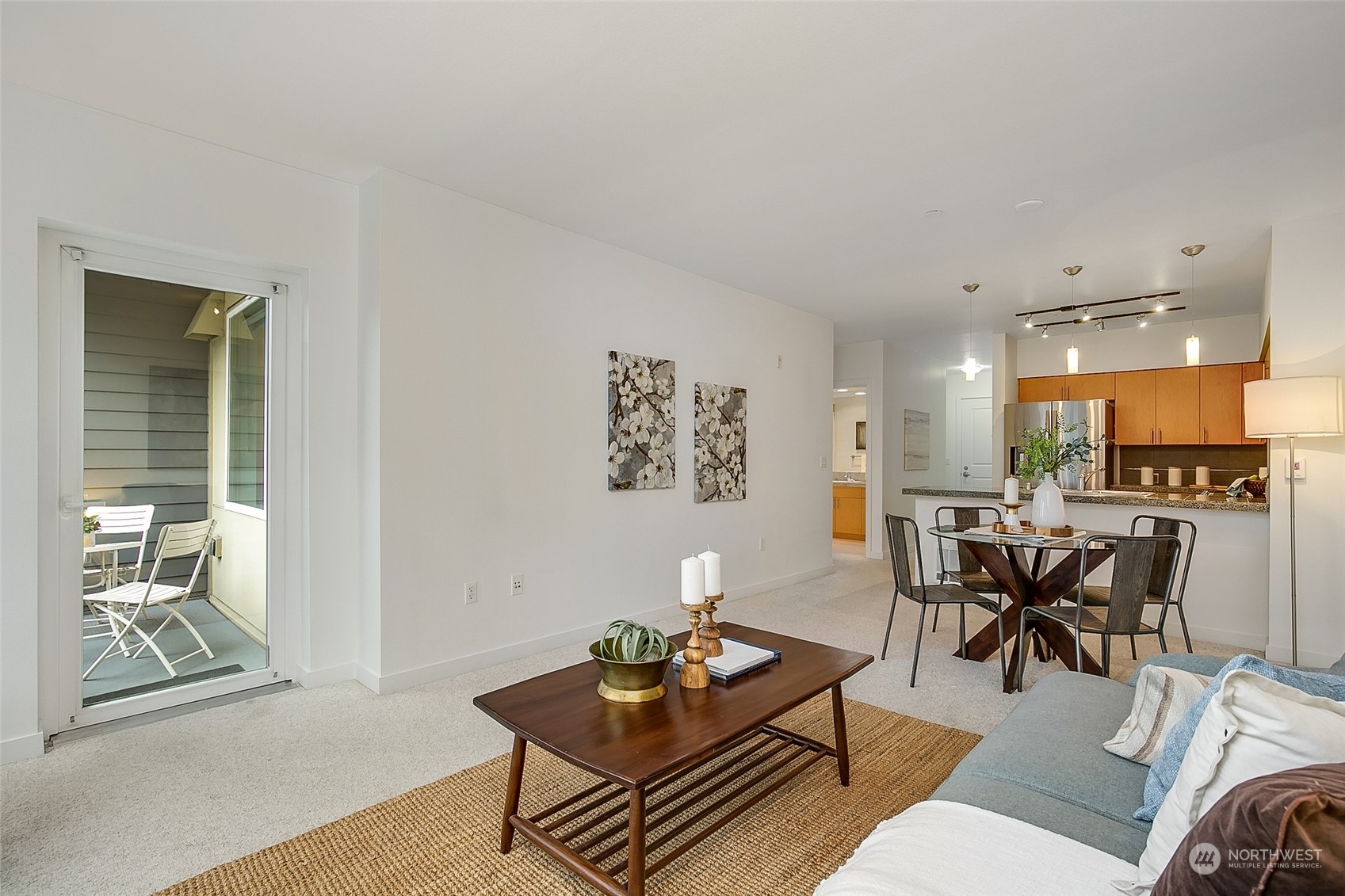 5440 Leary Avenue Northwest, Unit 417 Seattle, WA 98107 - Photo 5 of 21 a living room with furniture and a large window
