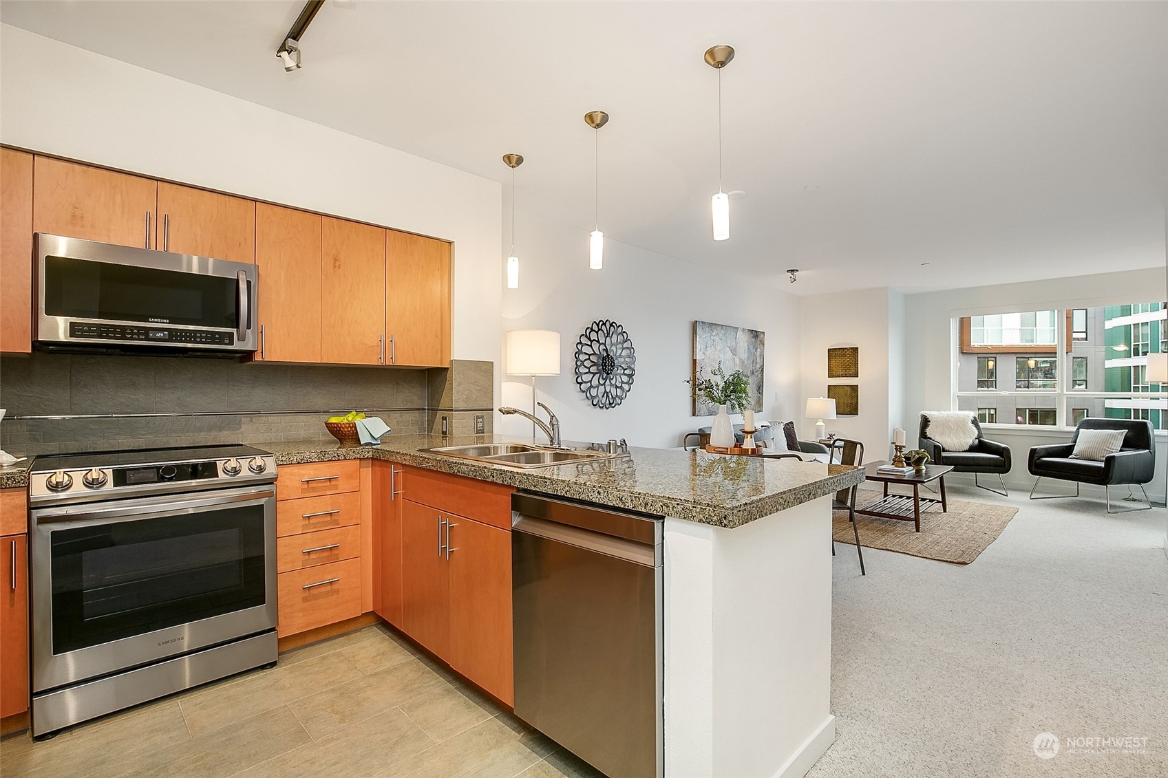 5440 Leary Avenue Northwest, Unit 417 Seattle, WA 98107 - Photo 8 of 21 a kitchen with sink stove and cabinets