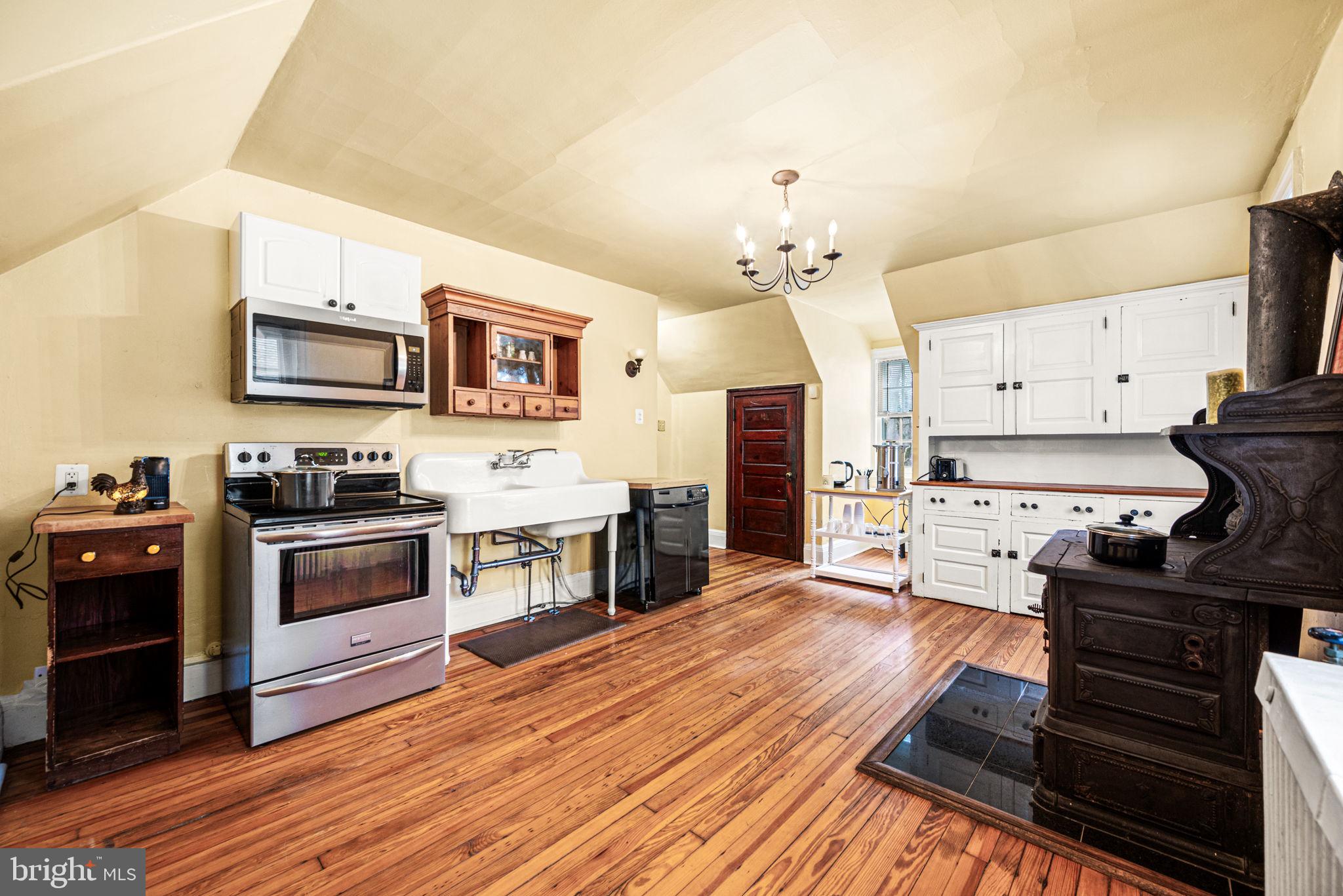 1018 Beech Road Wallingford, PA 19086 - Photo 57 of 66 a kitchen with stainless steel appliances a stove a sink and a refrigerator