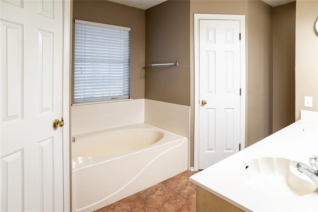 604 Valleyridge Court Decatur, TX 76234 - Photo 16 of 23 Primary bath with Garden Tub and separate stand up shower