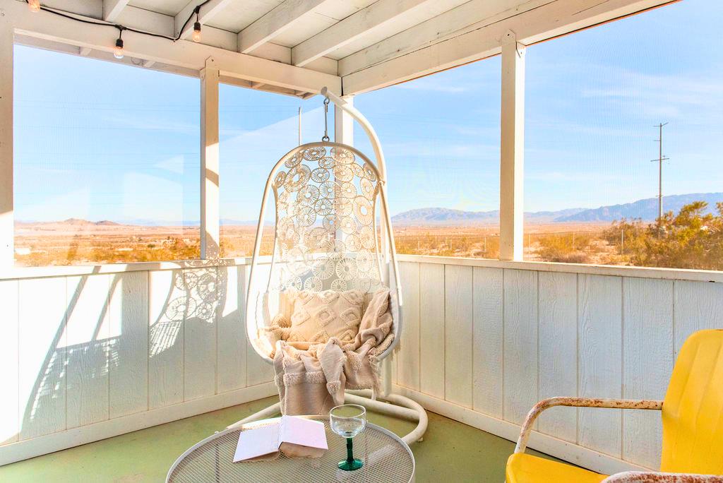 1195 Canyon Road Twentynine Palms, CA 92277 - Photo 17 of 25 a view of a balcony with table and chairs