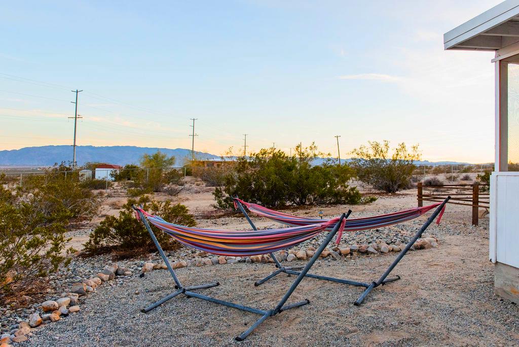 1195 Canyon Road Twentynine Palms, CA 92277 - Photo 20 of 25 a view of a terrace with furniture and a garden