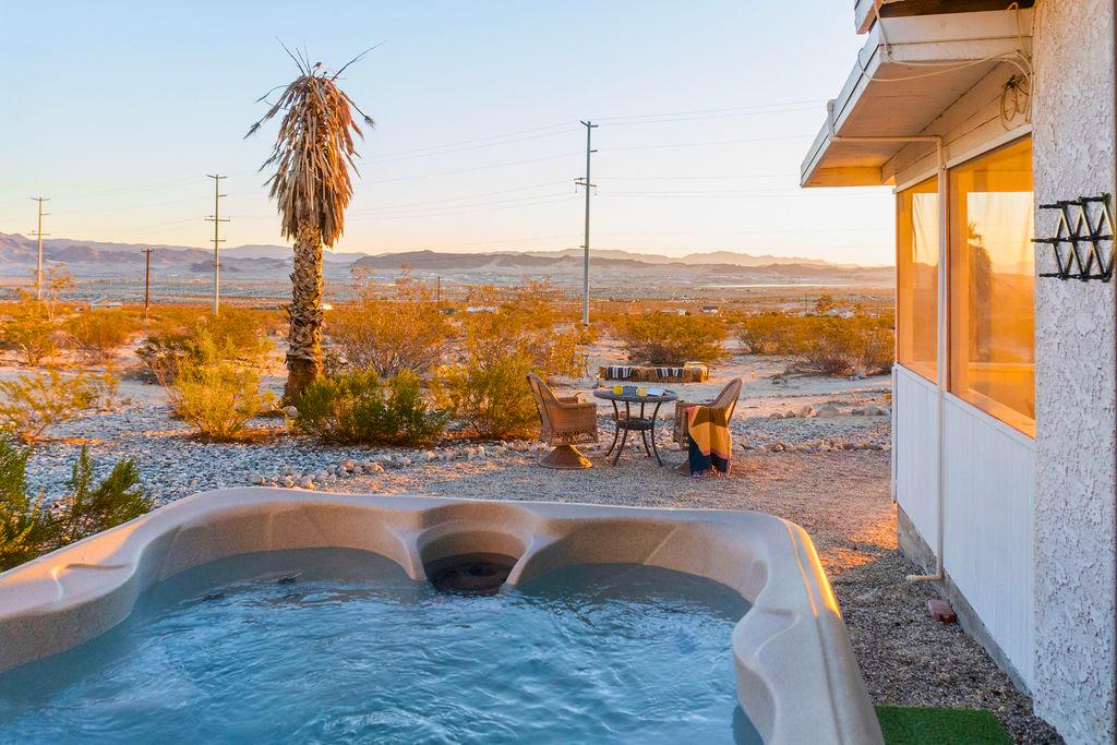 1195 Canyon Road Twentynine Palms, CA 92277 - Photo 22 of 25 a view of a swimming pool with a chair