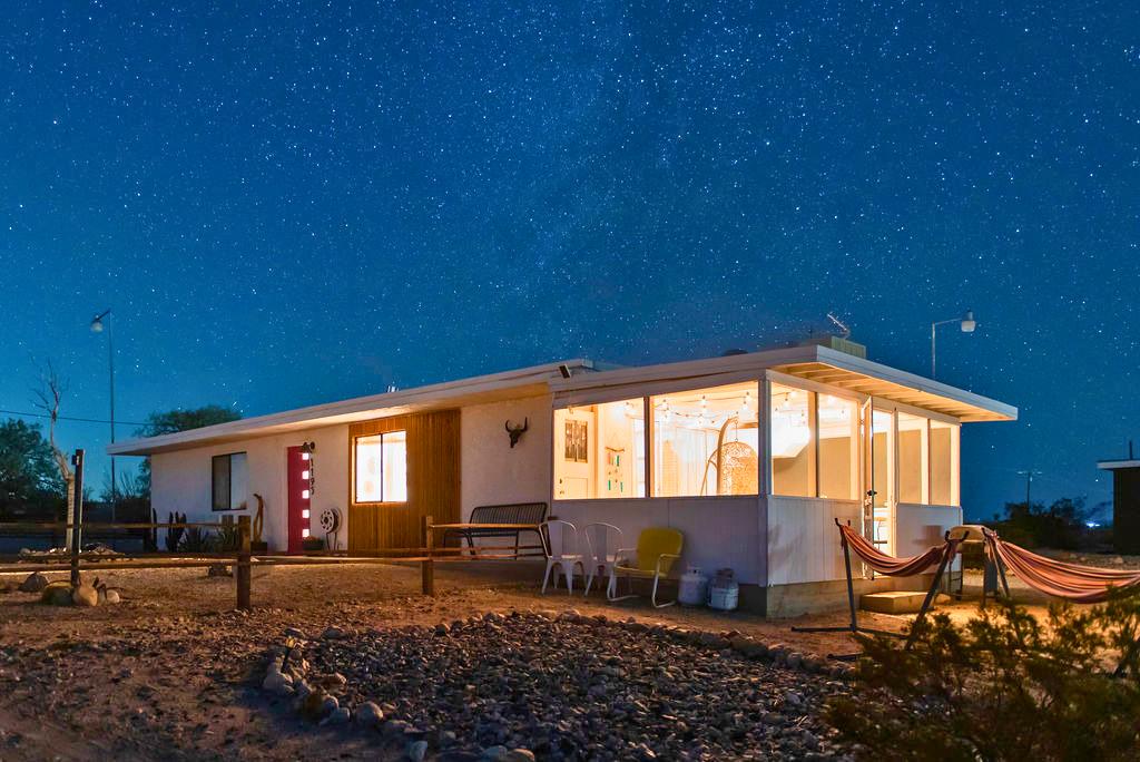 1195 Canyon Road Twentynine Palms, CA 92277 - Photo 6 of 25 a backyard of a house with barbeque oven table and chairs