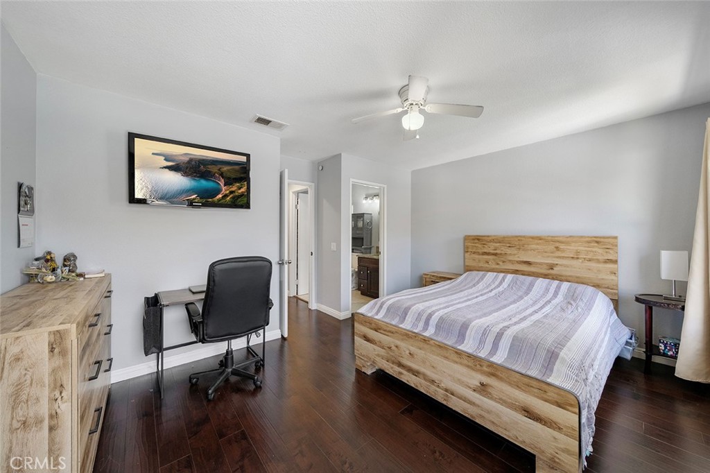 871 West 13th Street, Unit 4 Azusa, CA 91702 - Photo 15 of 22 a bedroom with a bed and a chair