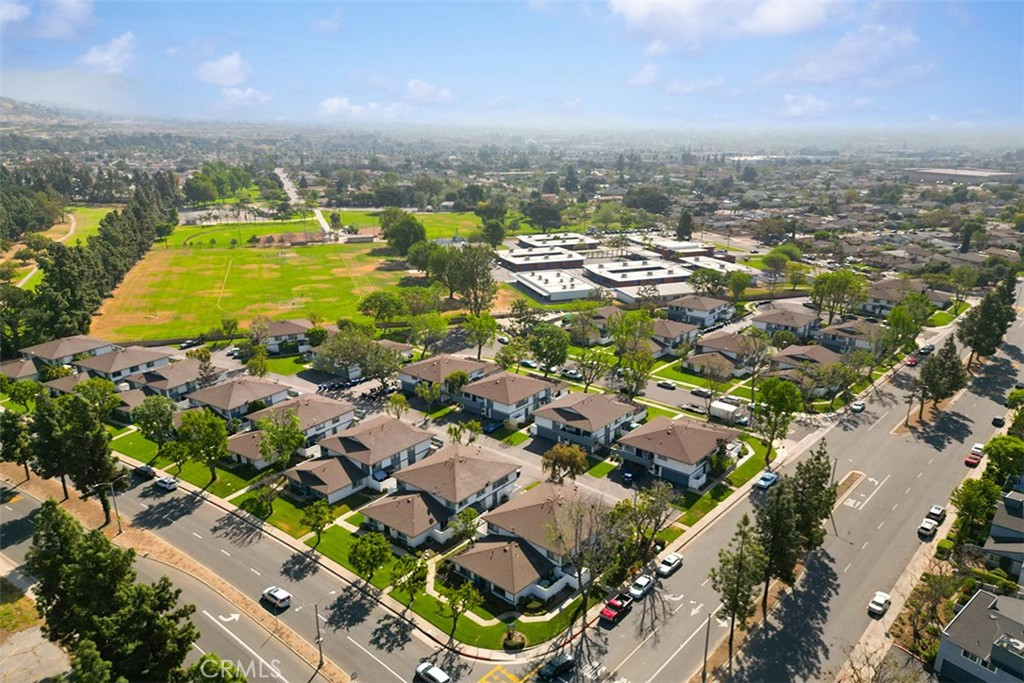 871 West 13th Street, Unit 4 Azusa, CA 91702 - Photo 22 of 22 an aerial view of residential houses with outdoor space