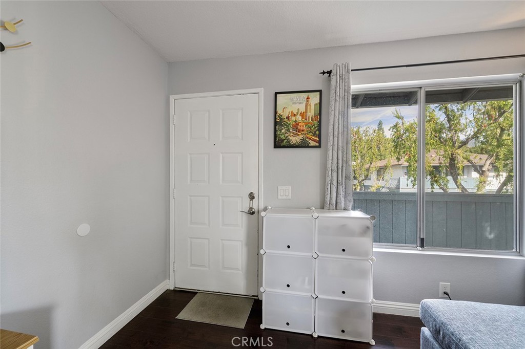871 West 13th Street, Unit 4 Azusa, CA 91702 - Photo 3 of 22 a view of room with baby crib and window