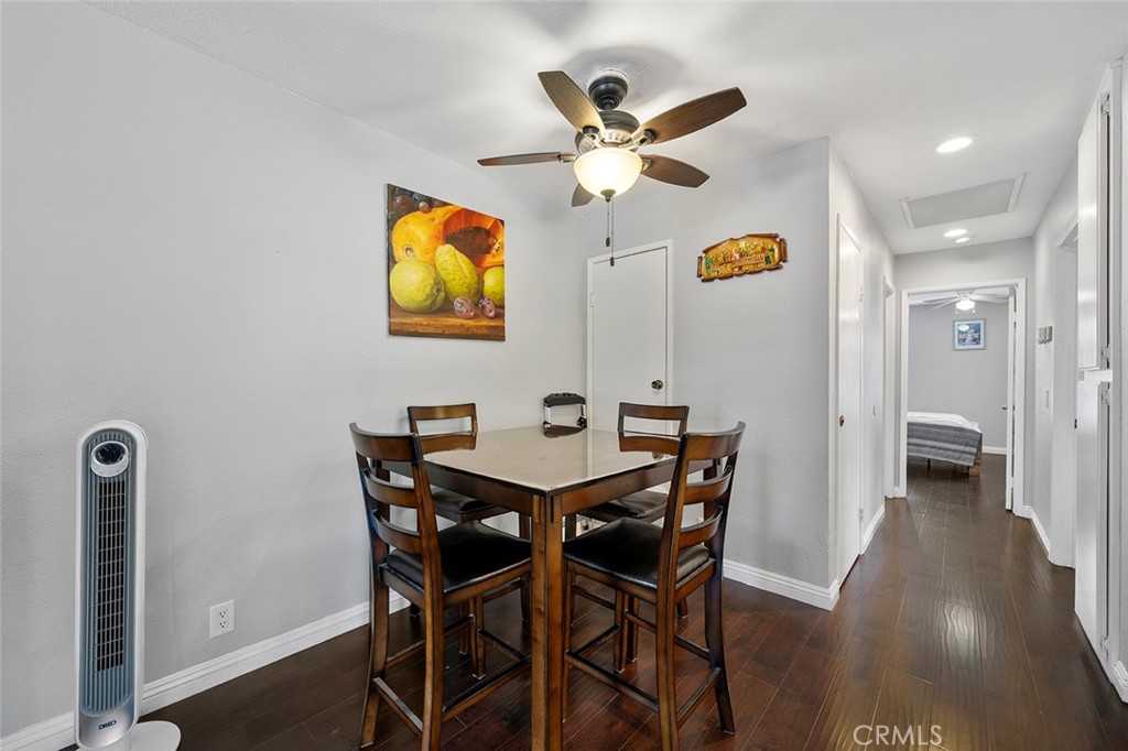 871 West 13th Street, Unit 4 Azusa, CA 91702 - Photo 8 of 22 a view of a dining room with furniture and wooden floor