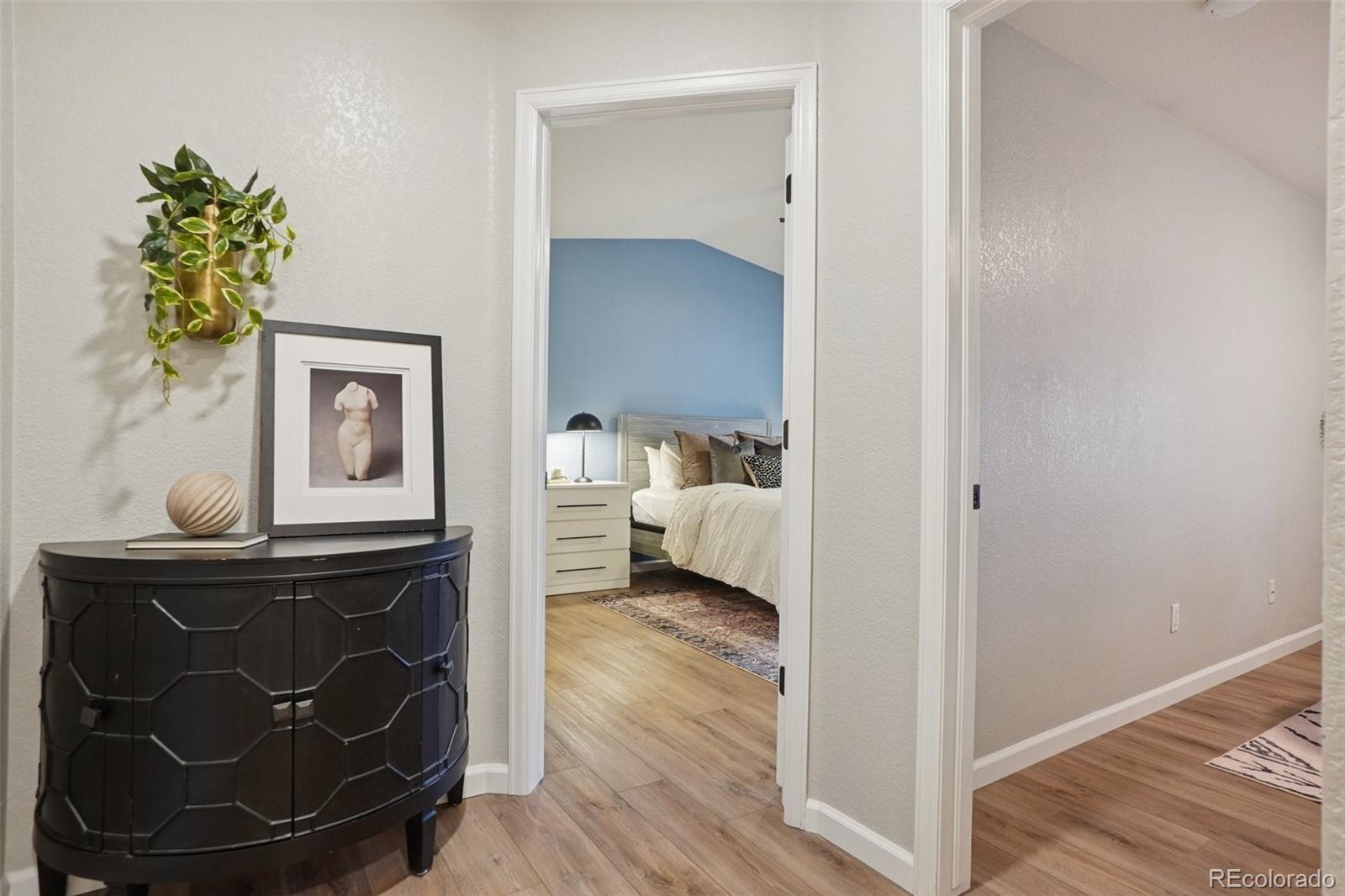 4271 South Blackhawk Circle, Unit 2C Aurora, CO 80014 - Photo 23 of 45 a living room with furniture and wooden floor