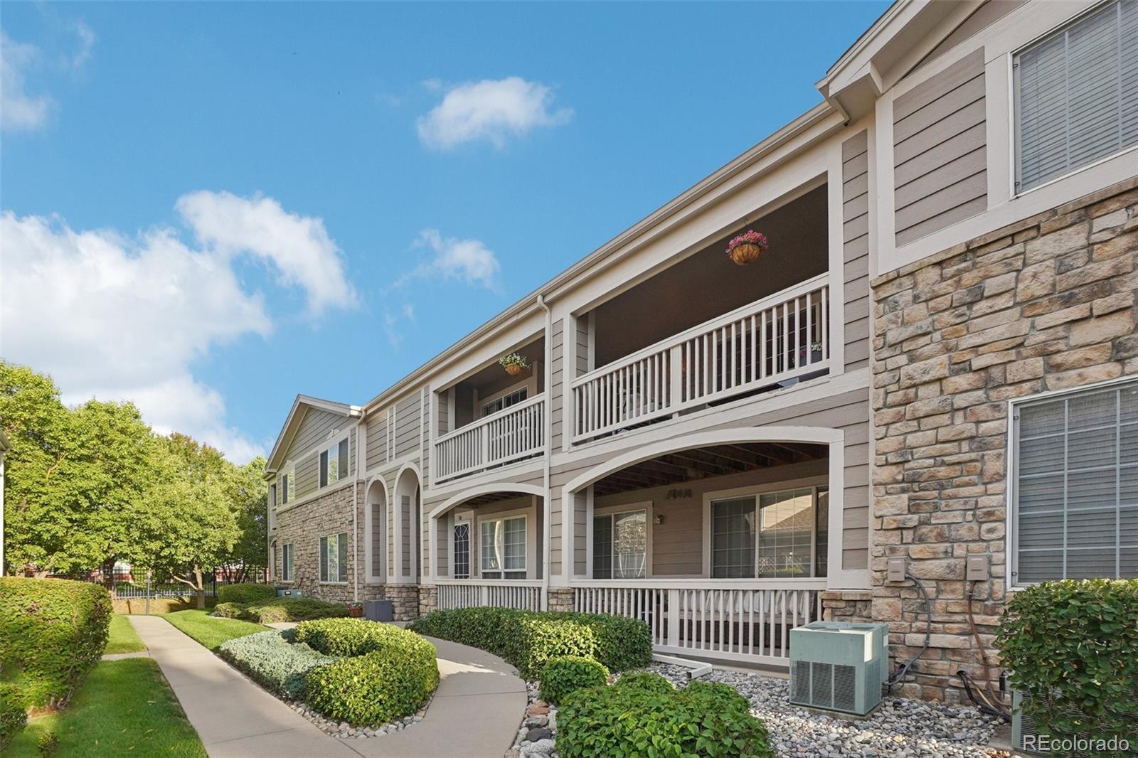 4271 South Blackhawk Circle, Unit 2C Aurora, CO 80014 - Photo 38 of 45 a front view of a house with a yard