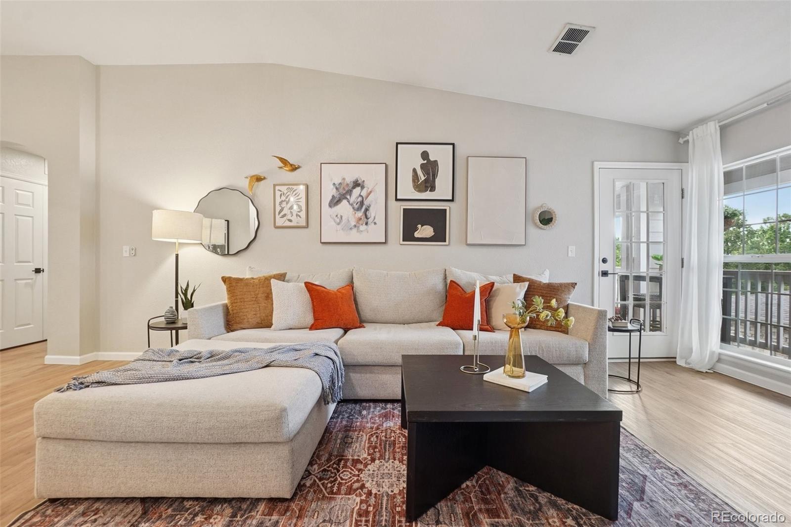 4271 South Blackhawk Circle, Unit 2C Aurora, CO 80014 - Photo 5 of 45 a living room with furniture and wooden floor