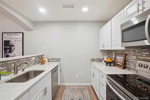 a kitchen with a stove and a microwave