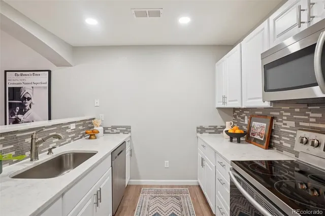 a kitchen with a stove and a microwave