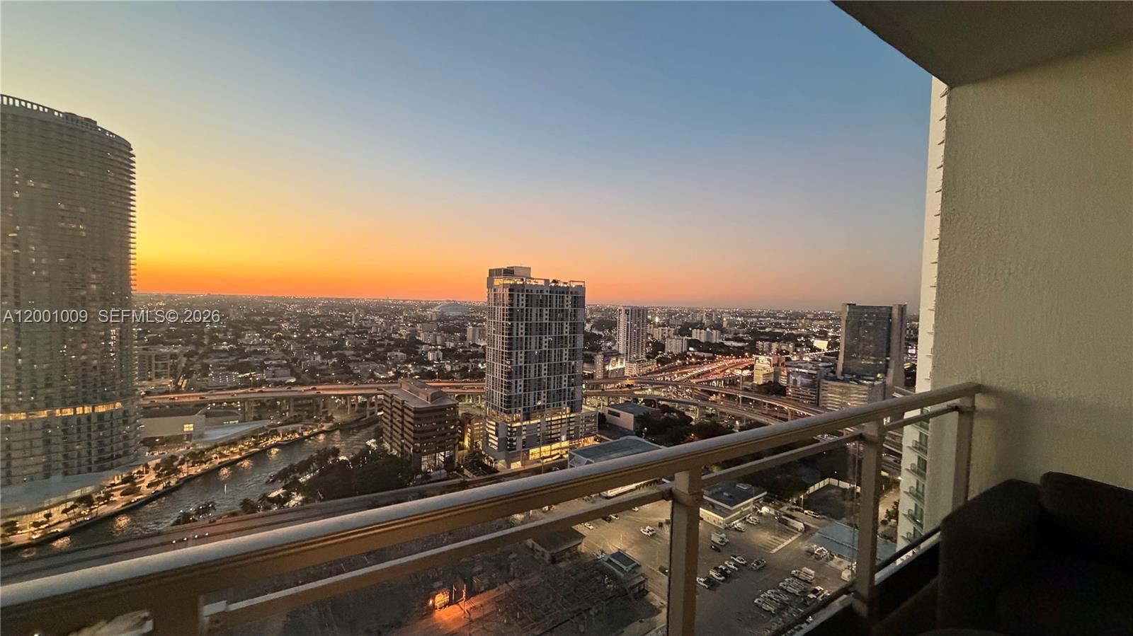 a view of a city skyline from a balcony