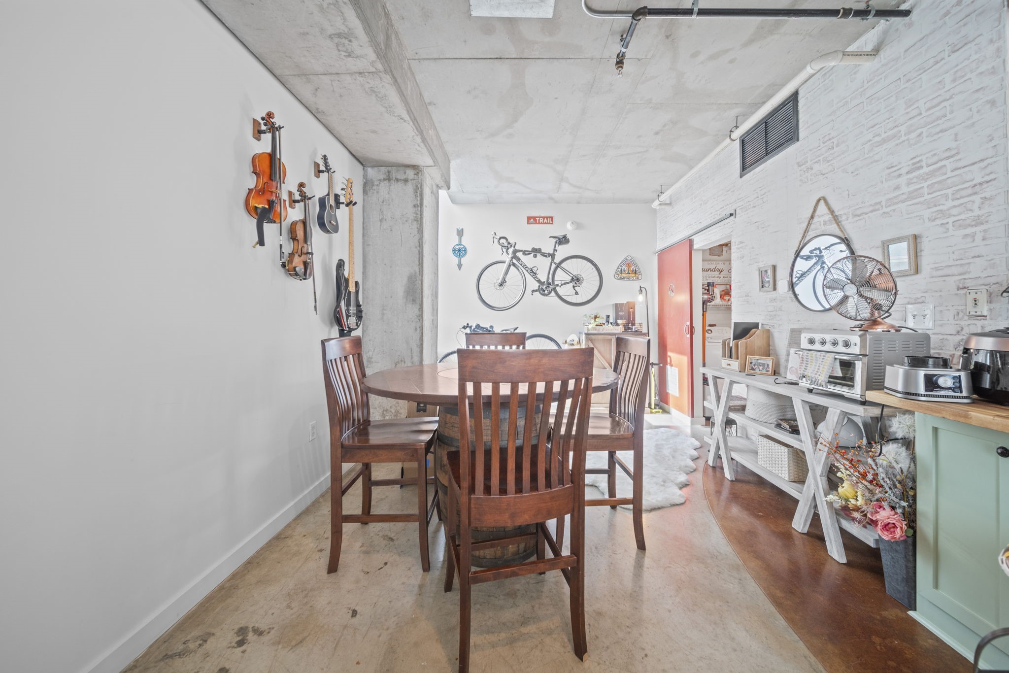 2000 Bagby Street, Unit 5417 Houston, TX 77002 - Photo 13 of 30 a view of a dining area with furniture and wooden floor