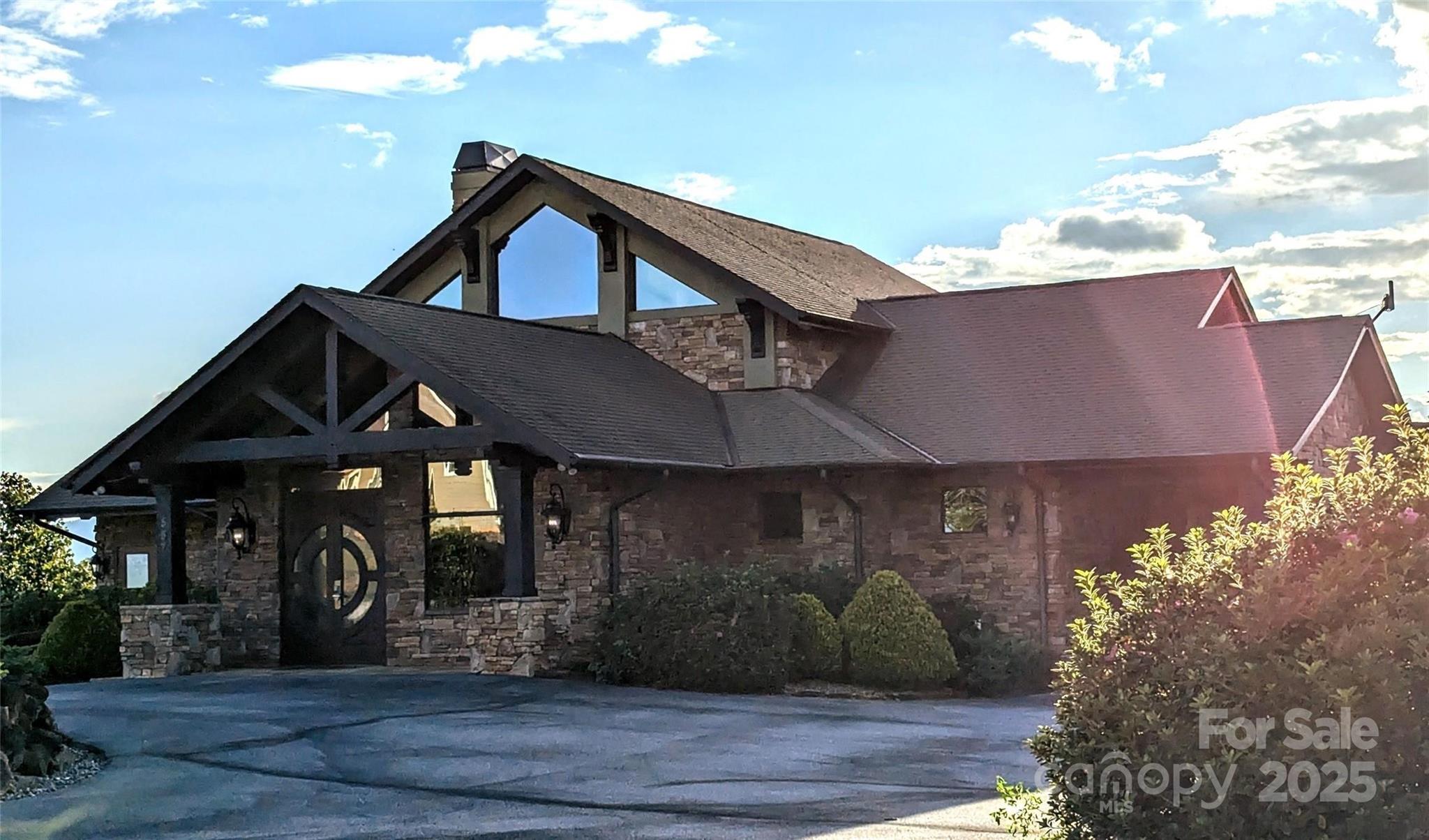 0 Golden Ridge Drive Lake Lure, NC 28746 - Photo 6 of 10 a front view of a house with garden