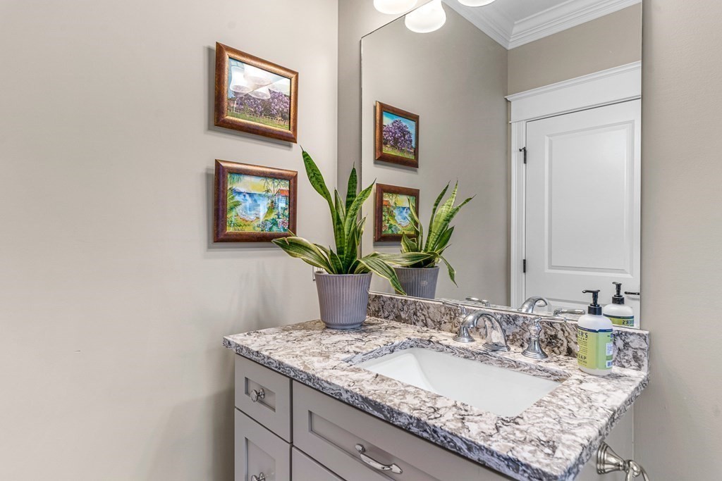 508 South Border Road Winchester, MA 01890 - Photo 17 of 41 a bathroom with a granite countertop sink and a mirror