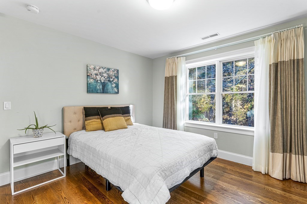 508 South Border Road Winchester, MA 01890 - Photo 27 of 41 a bedroom with a bed and a window
