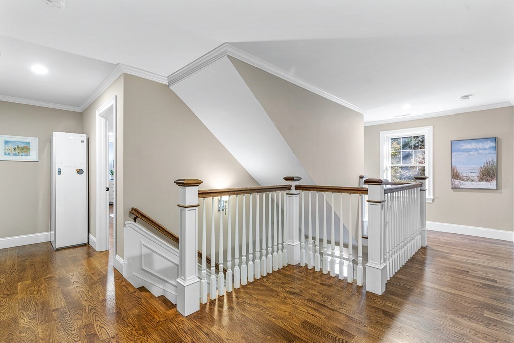 508 South Border Road Winchester, MA 01890 - Photo 28 of 41 a view of a hallway with stairs and a living room