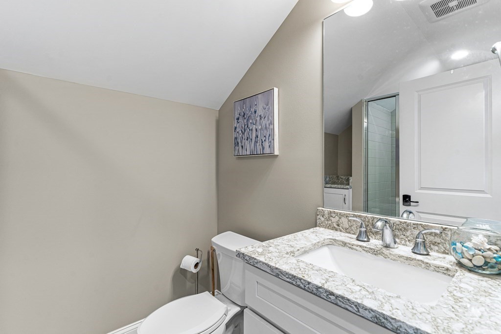 508 South Border Road Winchester, MA 01890 - Photo 31 of 41 a bathroom with a granite countertop sink mirror vanity and toilet