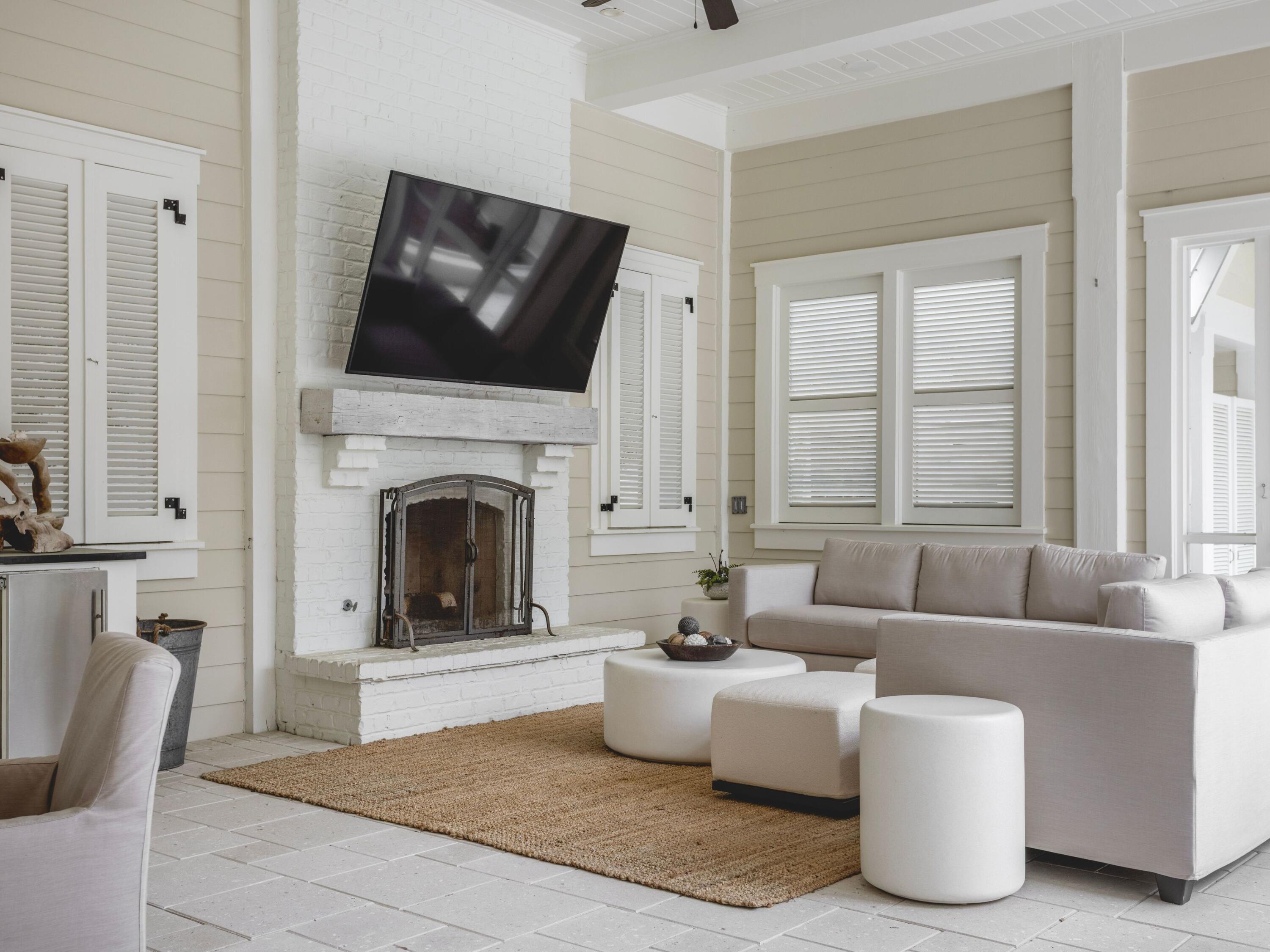 116 Wiregrass Way Santa Rosa Beach, FL 32459 - Photo 39 of 52 a living room with furniture a flat screen tv and a fireplace
