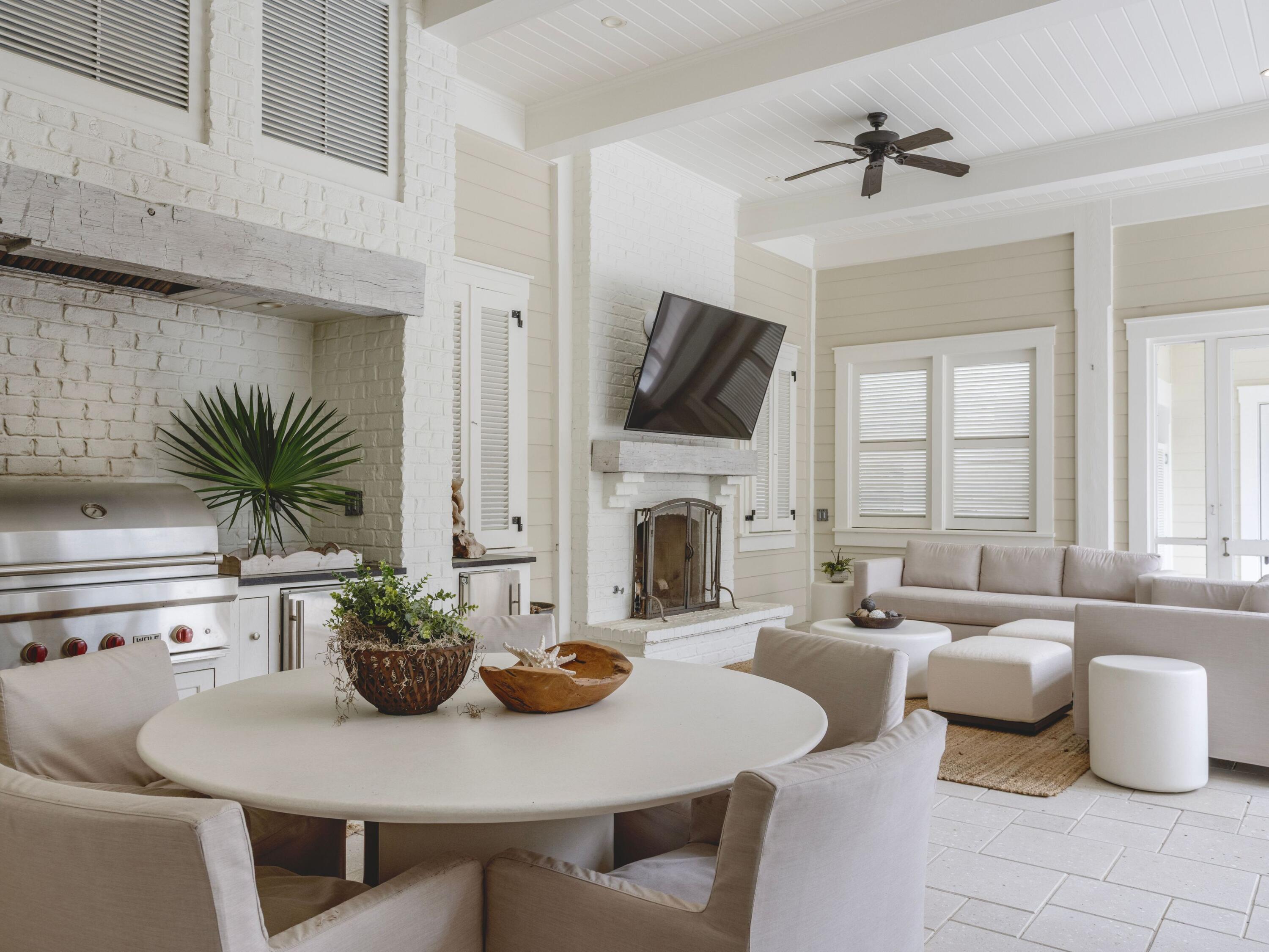 116 Wiregrass Way Santa Rosa Beach, FL 32459 - Photo 7 of 52 a living room with furniture a fireplace and a potted plant