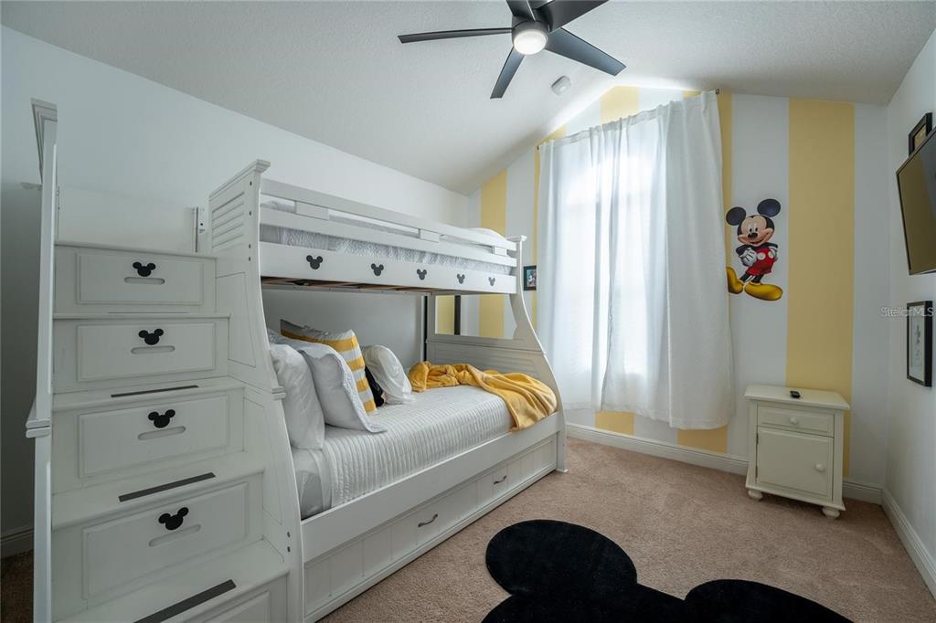 8223 Roseville Road Davenport, FL 33896 - Photo 12 of 17 a bedroom with a bed and a window