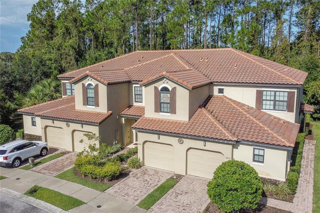 8223 Roseville Road Davenport, FL 33896 - Photo 2 of 17 a aerial view of a house with a garden