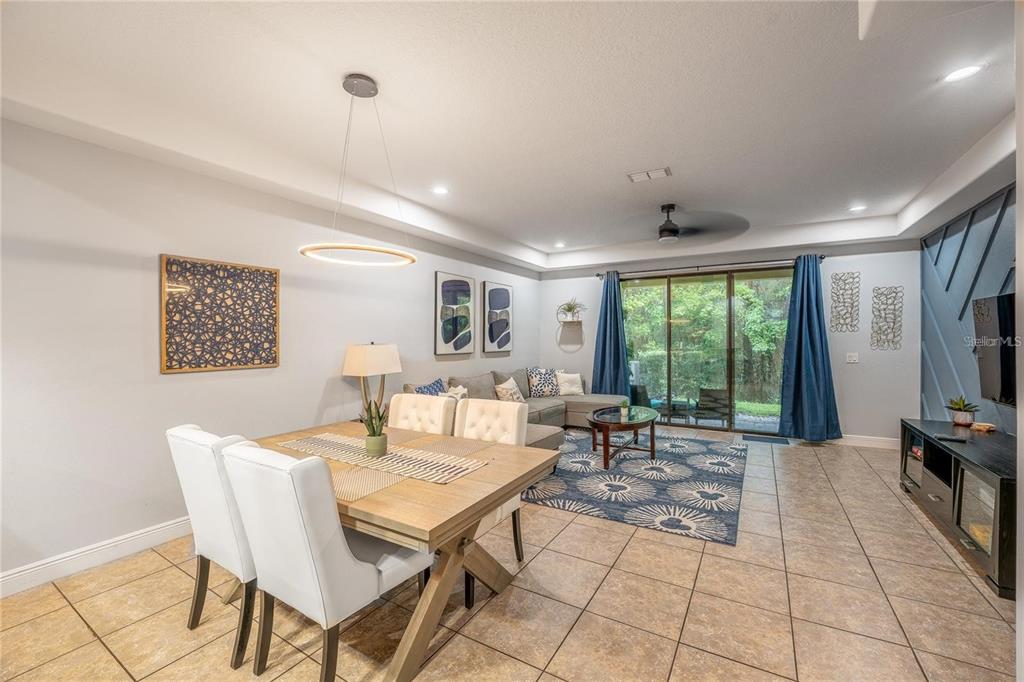 8223 Roseville Road Davenport, FL 33896 - Photo 5 of 17 a living room with fireplace furniture and a large window