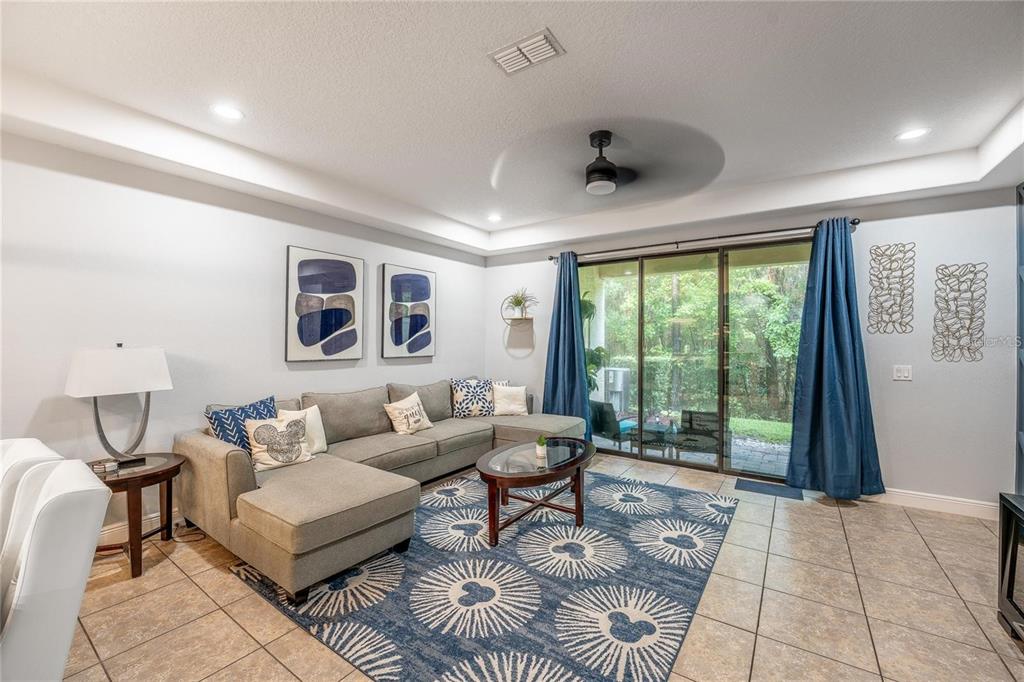8223 Roseville Road Davenport, FL 33896 - Photo 7 of 17 a living room with furniture and a large window