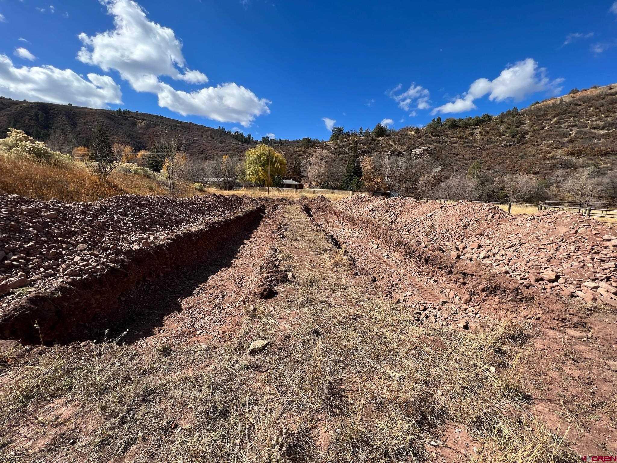 31 Turtle Lake Meadows Drive Durango, CO 81301 - Photo 14 of 27 a view of a yard covered with snow in the background