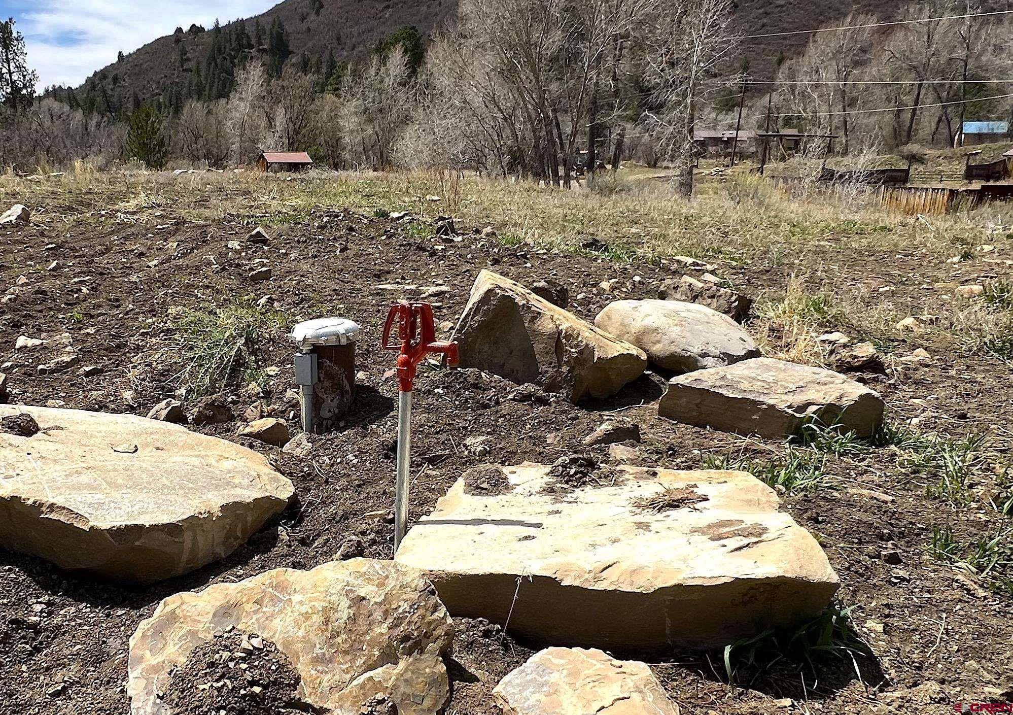 31 Turtle Lake Meadows Drive Durango, CO 81301 - Photo 20 of 27 a view of a backyard of white house