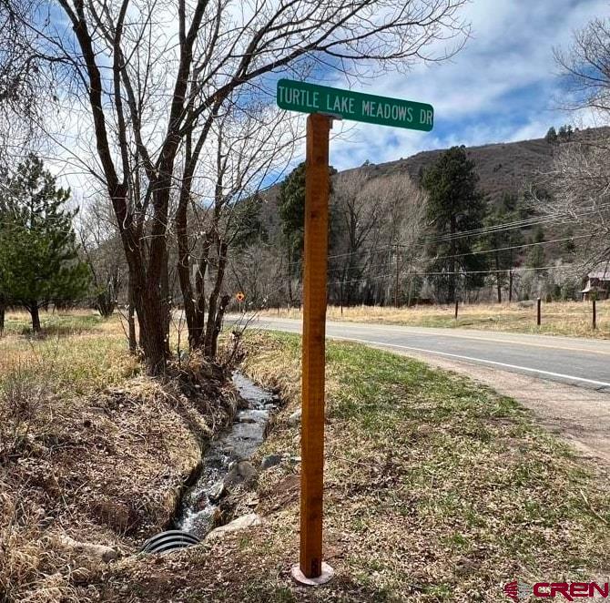 31 Turtle Lake Meadows Drive Durango, CO 81301 - Photo 23 of 27 a view of a yard with a tree