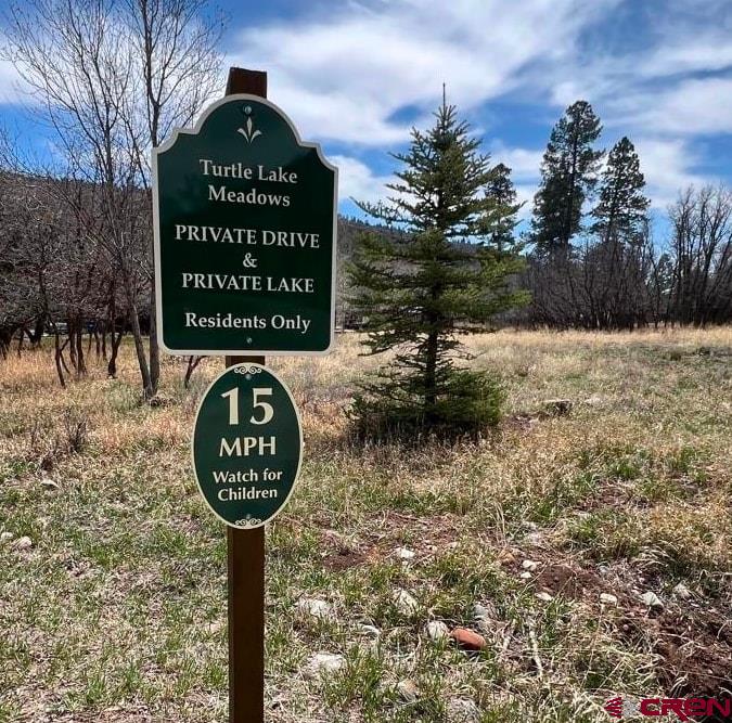 31 Turtle Lake Meadows Drive Durango, CO 81301 - Photo 26 of 27 a sign board with a lake view