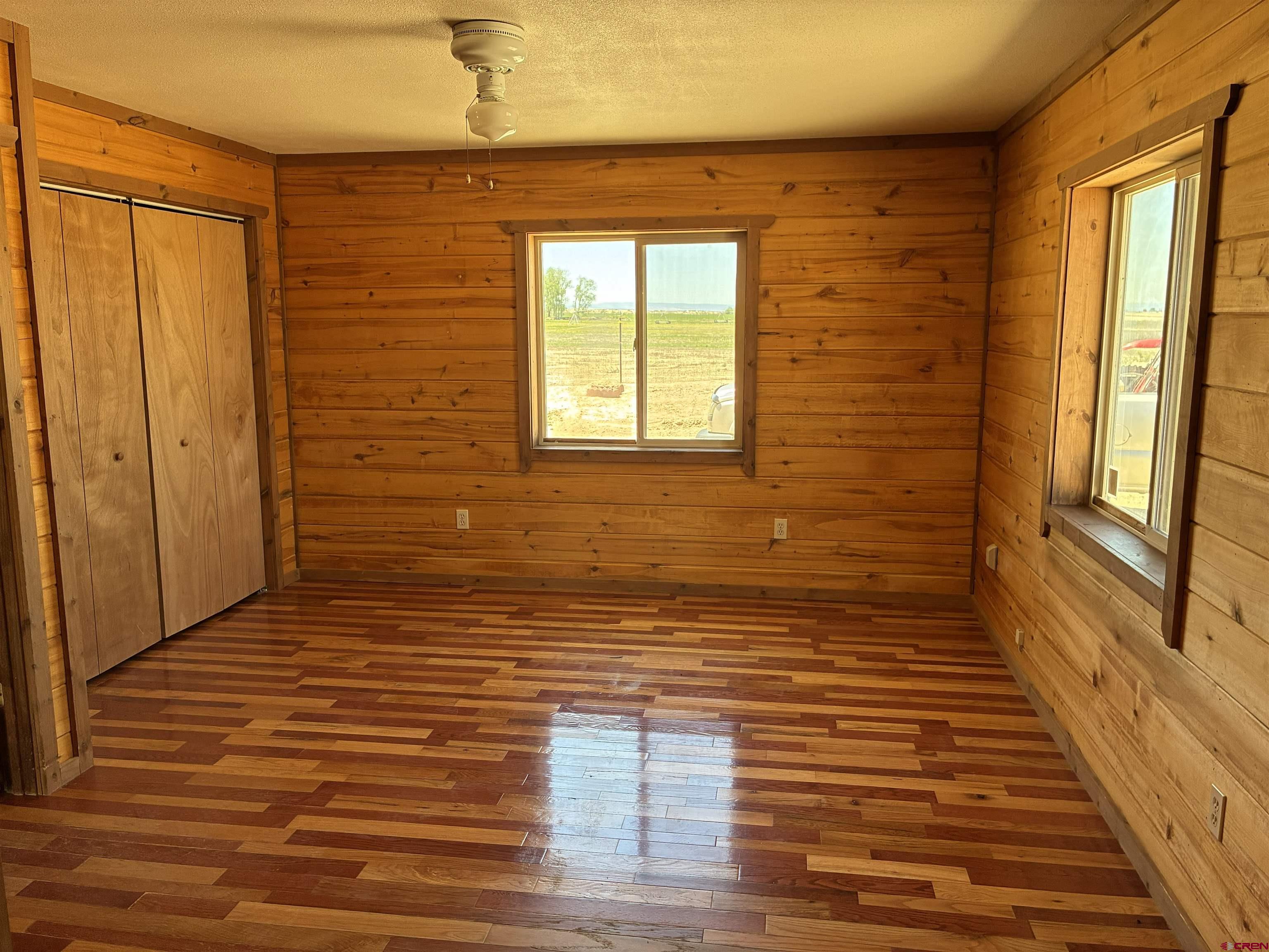 4491 2300th Road Delta, CO 81416 - Photo 9 of 25 a view of a livingroom with wooden floor and a window