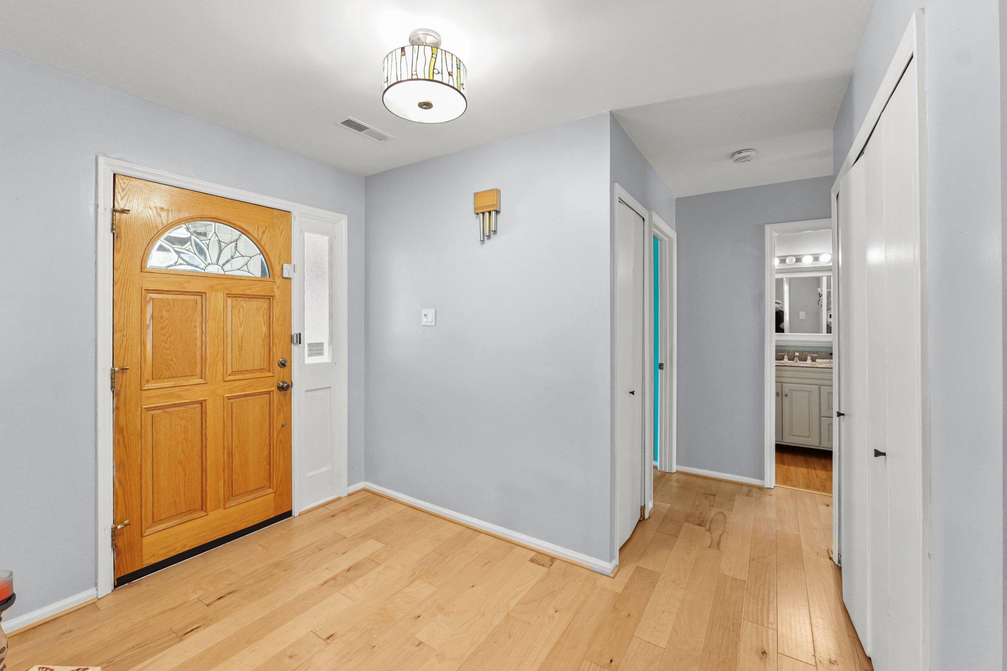 8871 Butternut Street Manassas, VA 20110 - Photo 13 of 29 Foyer and hallway to bedrooms.