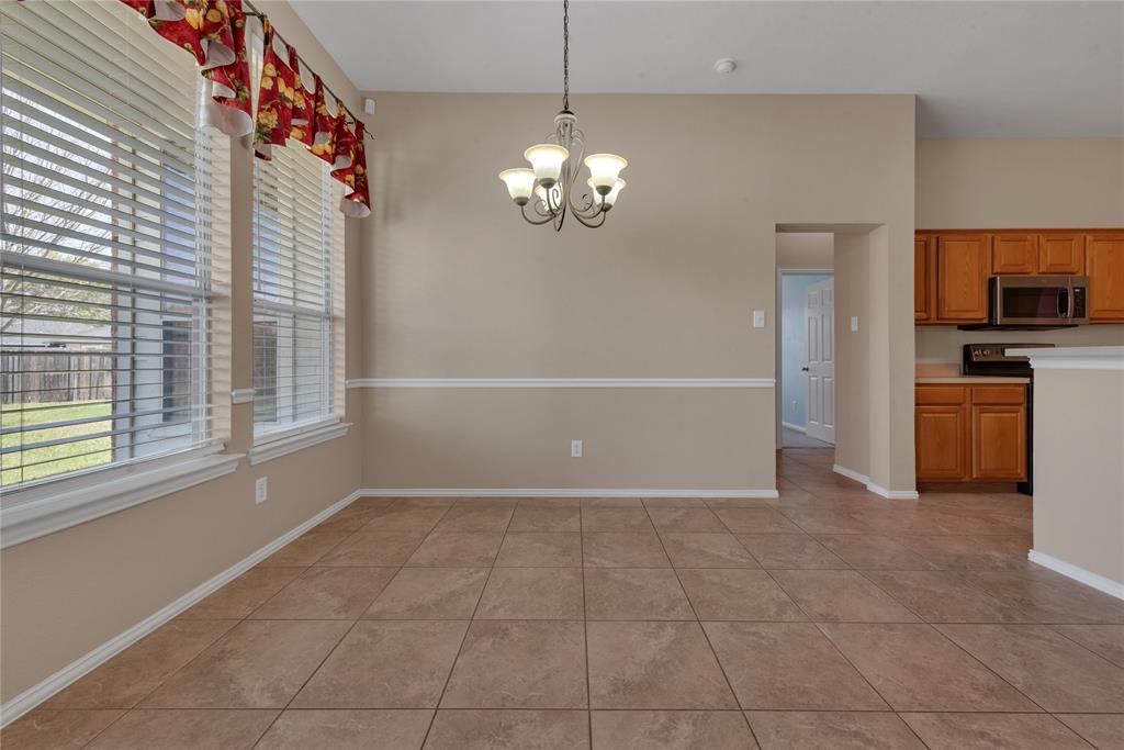 910 Derby Court Celina, TX 75009 - Photo 12 of 27 a view of a kitchen with a sink and dishwasher