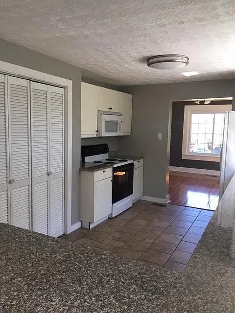 191 Old Mt Juliet Road Mount Juliet, TN 37122 - Photo 5 of 15 a kitchen with stainless steel appliances granite countertop a stove a sink and a refrigerator