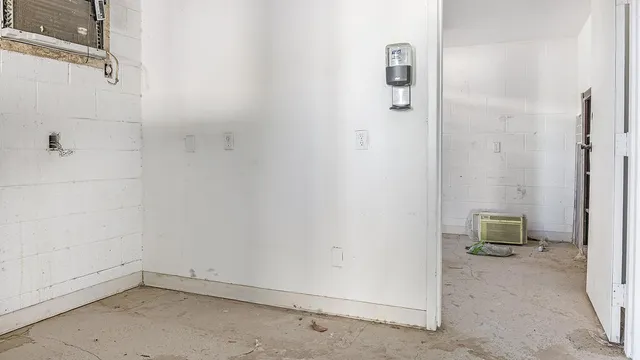 a view of an empty room with stairs