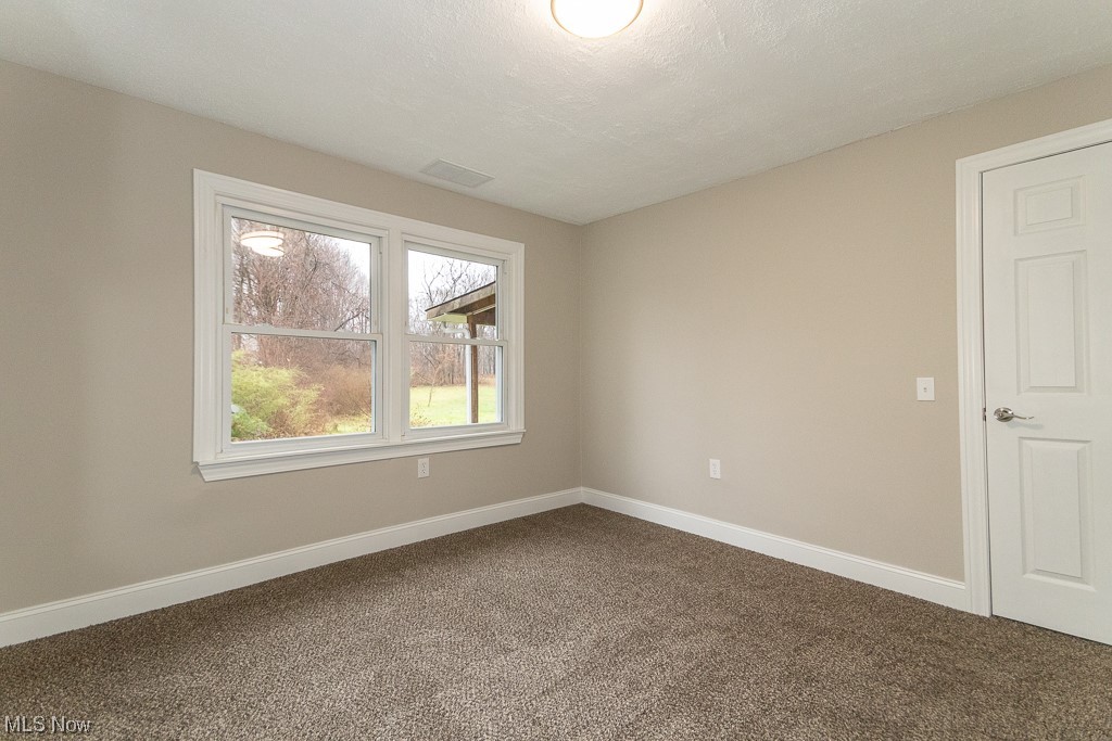 9865 Chillicothe Road Kirtland, OH 44094 - Photo 24 of 36 Empty room with carpet