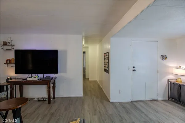 a view of a livingroom with furniture and wooden floor