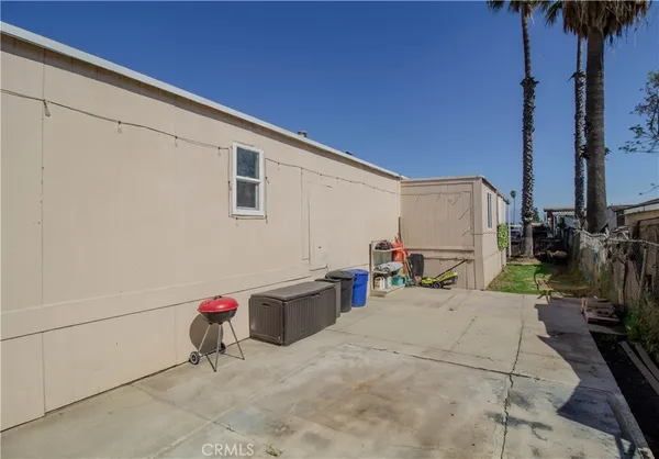 a view of backyard with tub