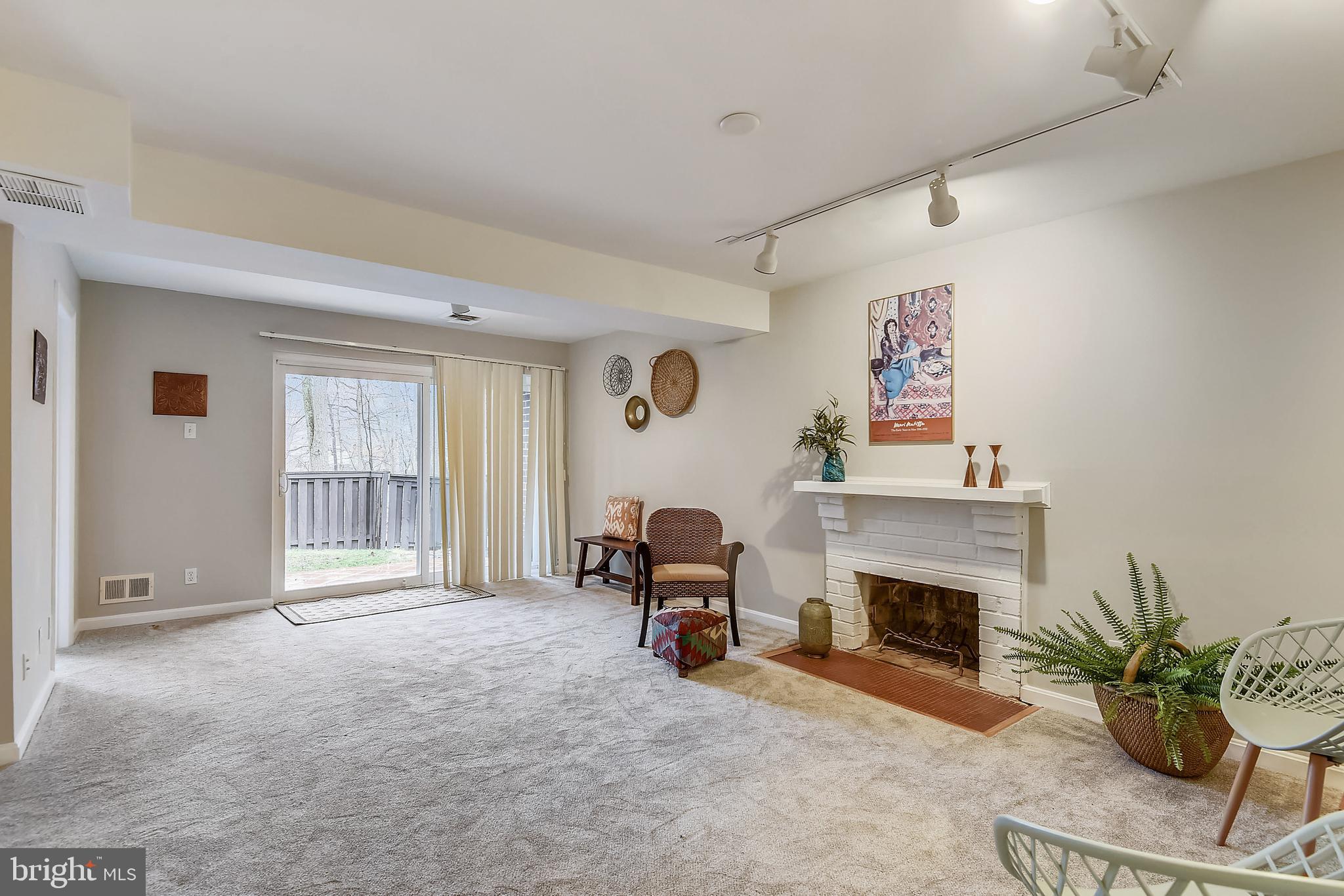 11061 Saffold Way Reston, VA 20190 - Photo 41 of 51 Rec room with Wood-burning fpl