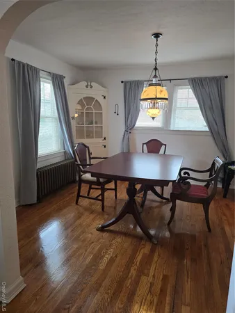 a workspace room with furniture and window