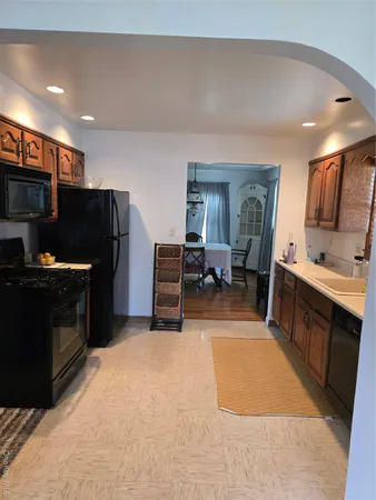 a kitchen with a stove and a microwave