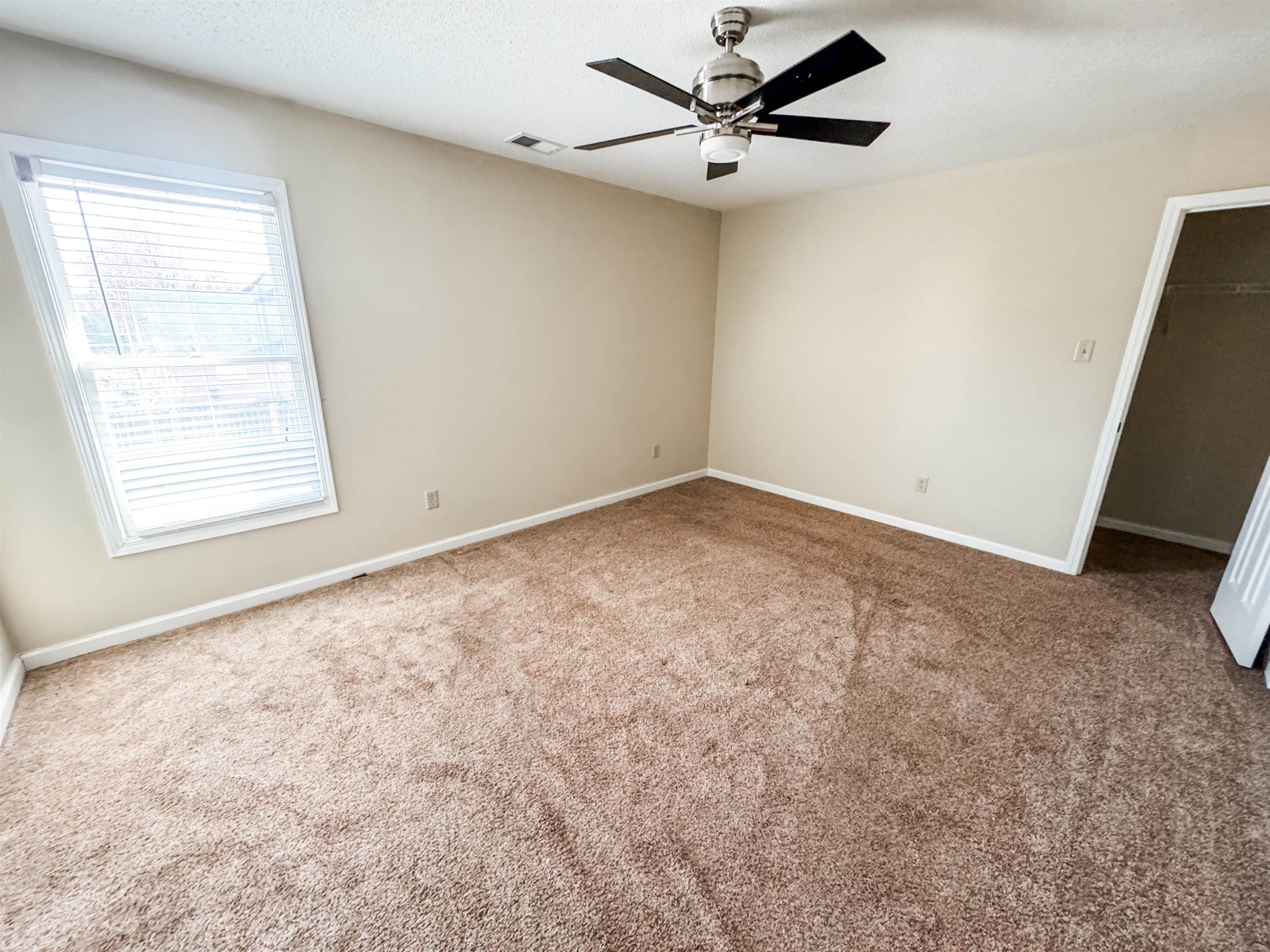 10431 Pilot Rock Road Collierville, TN 38017 - Photo 13 of 15 Carpeted spare room featuring ceiling fan